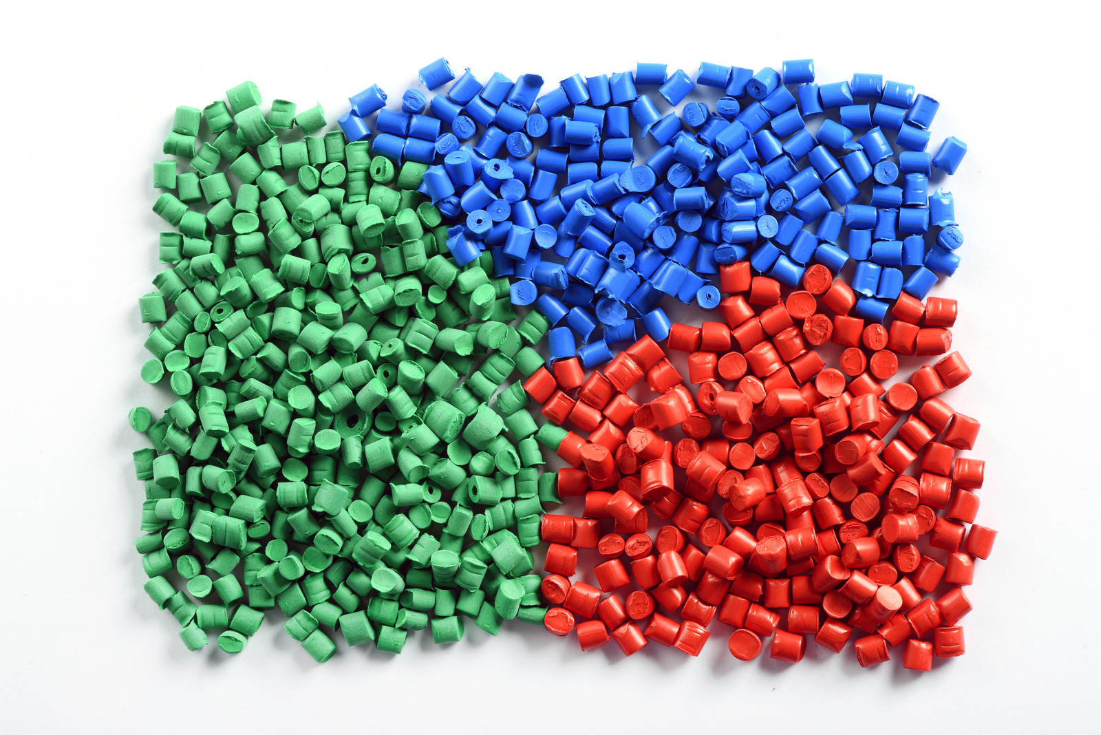 Green, blue, and red plastic pellets